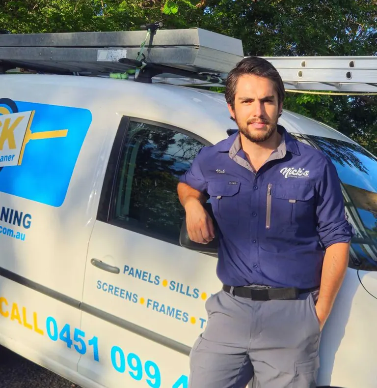 Nick, owner of Nick’s Window Cleaning, with his work van